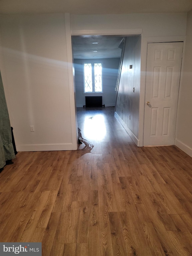 corridor featuring hardwood / wood-style flooring