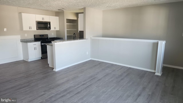 kitchen featuring white cabinetry, stainless steel appliances, and dark hardwood / wood-style floors