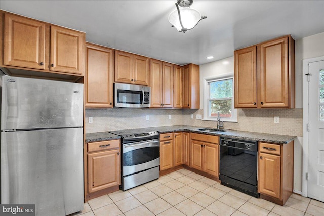 kitchen featuring sink, light tile patterned floors, stainless steel appliances, and tasteful backsplash