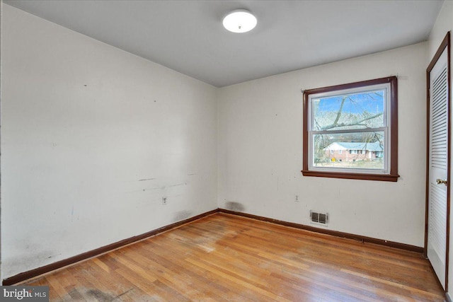 empty room featuring wood-type flooring