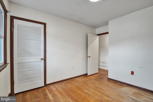 unfurnished room with light hardwood / wood-style floors