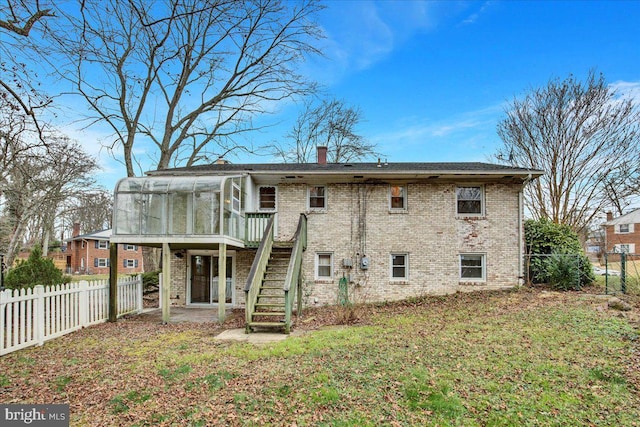 back of house with a sunroom