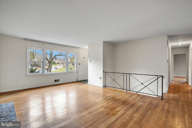 spare room with light wood-type flooring