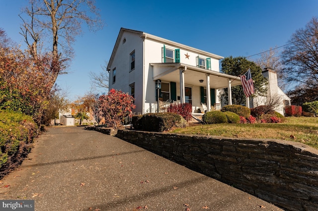 front facade featuring covered porch