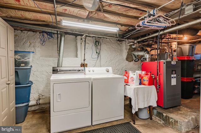 laundry area with separate washer and dryer