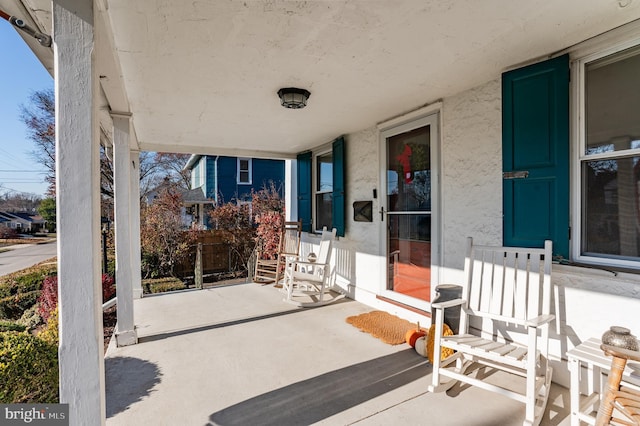 view of patio featuring a porch