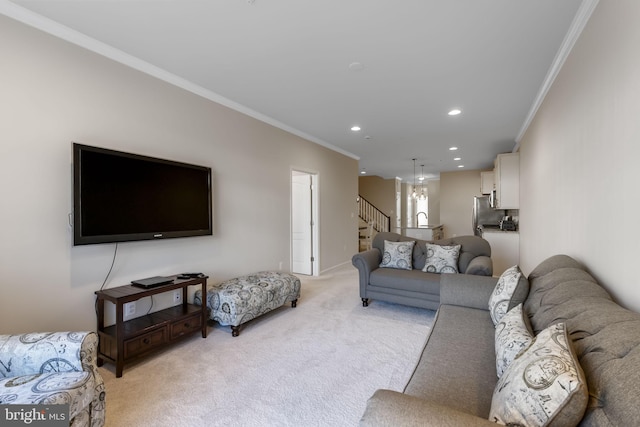 carpeted living room with ornamental molding