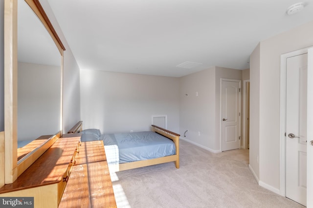 bedroom featuring light carpet