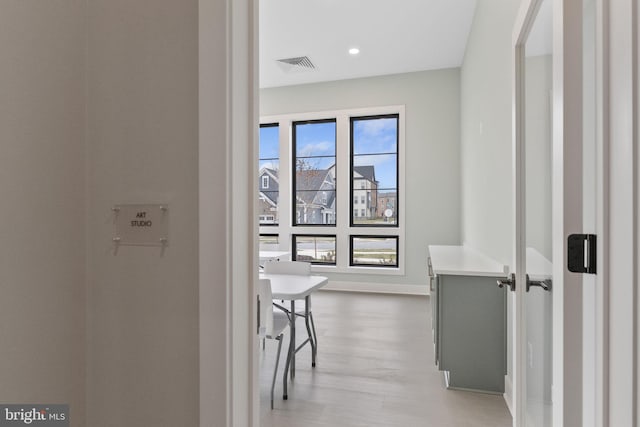 hallway featuring light hardwood / wood-style flooring