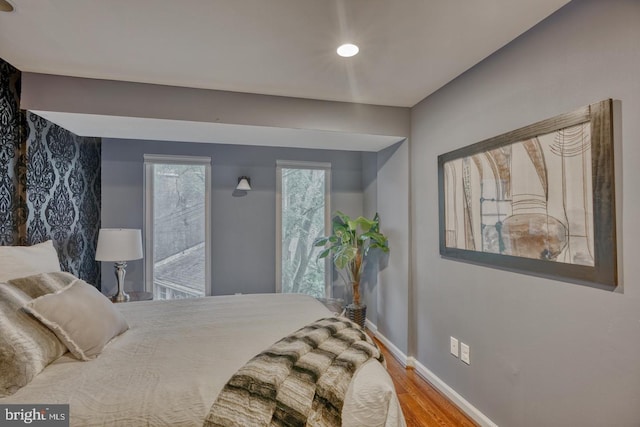 bedroom with hardwood / wood-style flooring