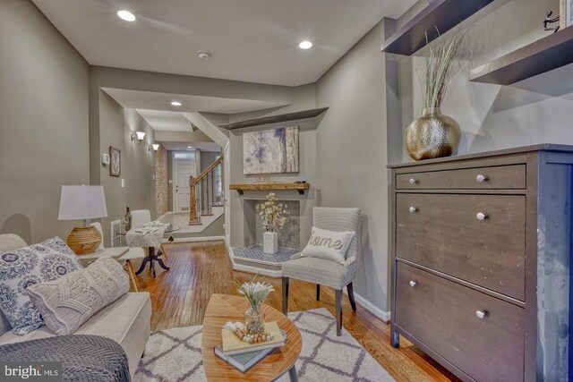 510 Druid Hill Ave, Baltimore, MD 21201 - living area featuring stairs, baseboards, light wood-style floors, and recessed lighting