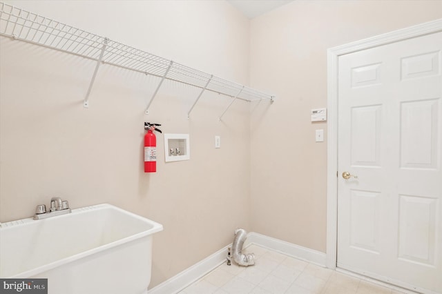 laundry room with washer hookup and sink