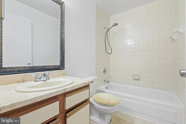 full bathroom with tile patterned flooring, vanity, toilet, and tiled shower / bath combo