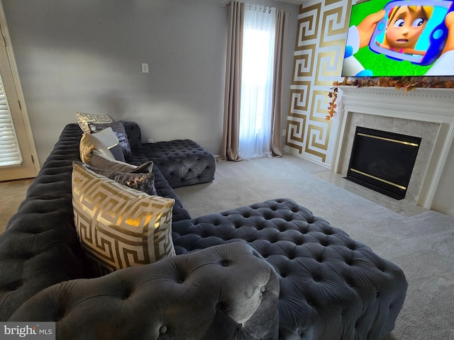 living room featuring a fireplace and light colored carpet