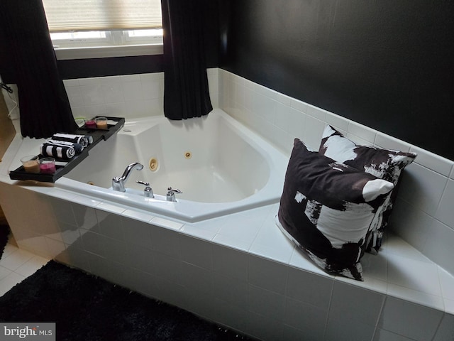 bathroom featuring a relaxing tiled tub