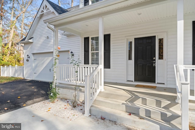 view of exterior entry featuring a garage