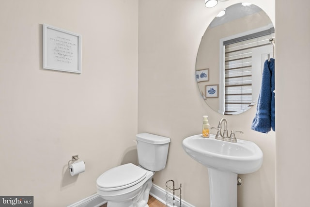 bathroom with sink and toilet