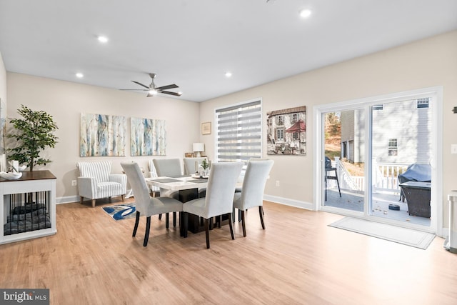 dining room with light wood-type flooring and ceiling fan