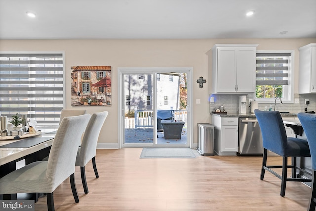 office space featuring sink and light hardwood / wood-style flooring