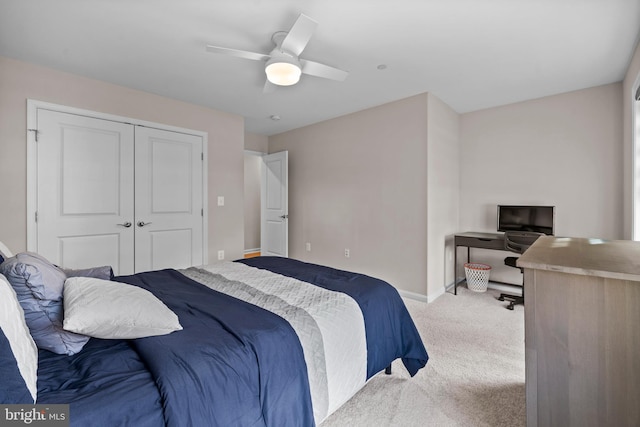 carpeted bedroom with a closet and ceiling fan