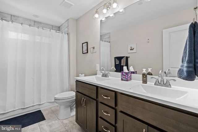 full bathroom with tile patterned flooring, vanity, shower / bath combination with curtain, and toilet