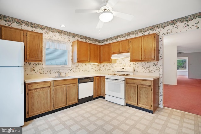 kitchen with ceiling fan, sink, light colored carpet, and white appliances