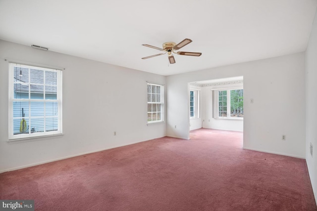 carpeted empty room with ceiling fan