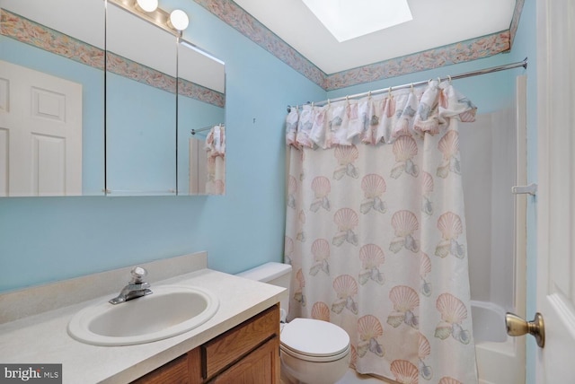 full bathroom featuring a skylight, vanity, shower / bathtub combination with curtain, and toilet