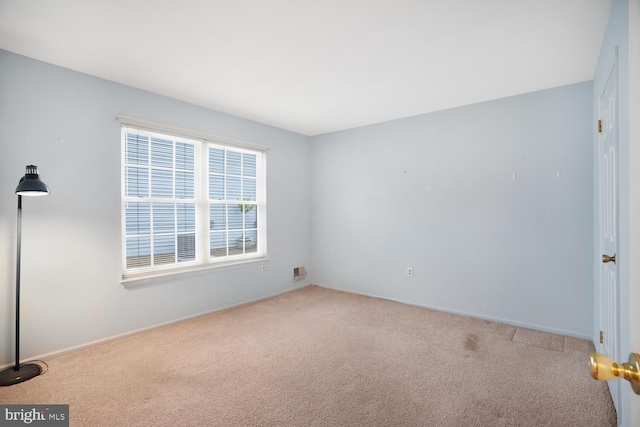 view of carpeted spare room