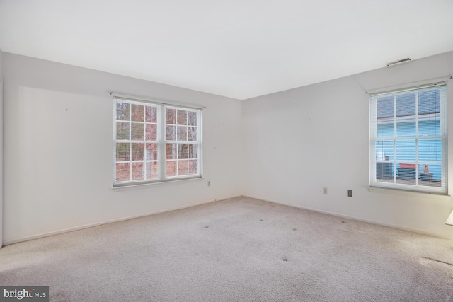 unfurnished room with carpet flooring