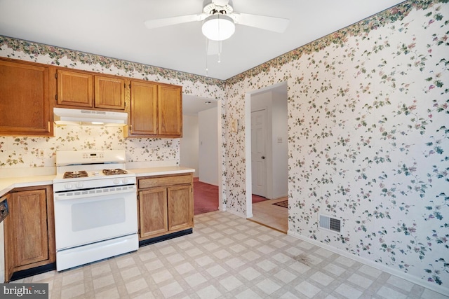 kitchen with ceiling fan and white range oven