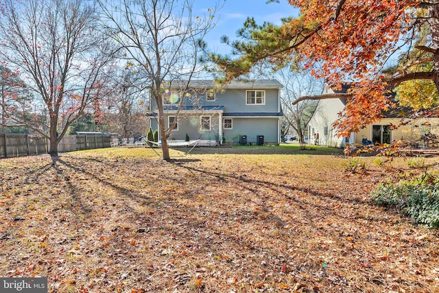 rear view of house with a yard