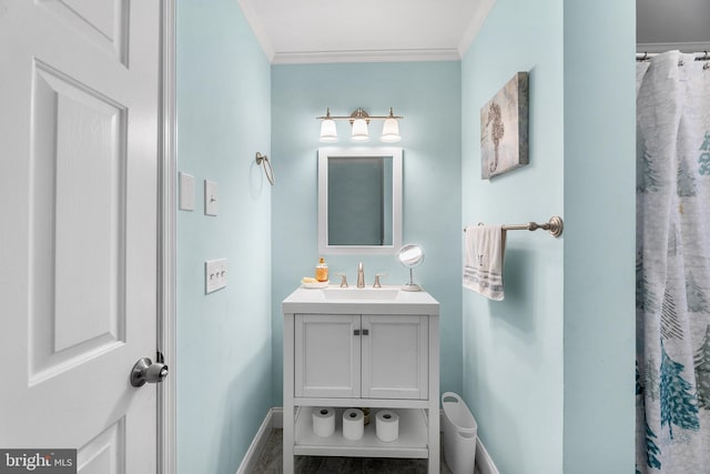 bathroom with vanity and crown molding