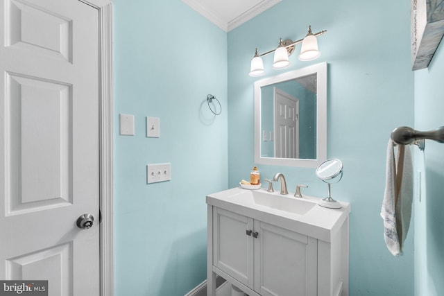 bathroom with vanity and ornamental molding