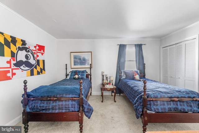 bedroom with a closet, carpet floors, and ornamental molding