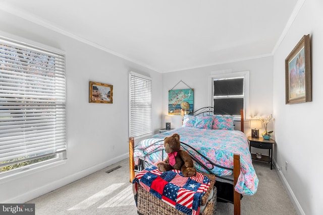 carpeted bedroom featuring crown molding