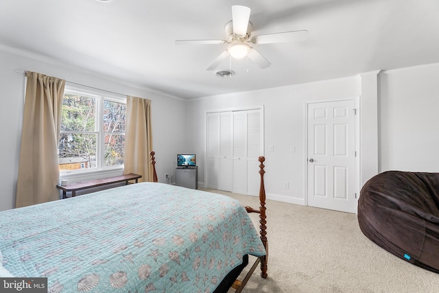 bedroom with carpet, ceiling fan, and crown molding