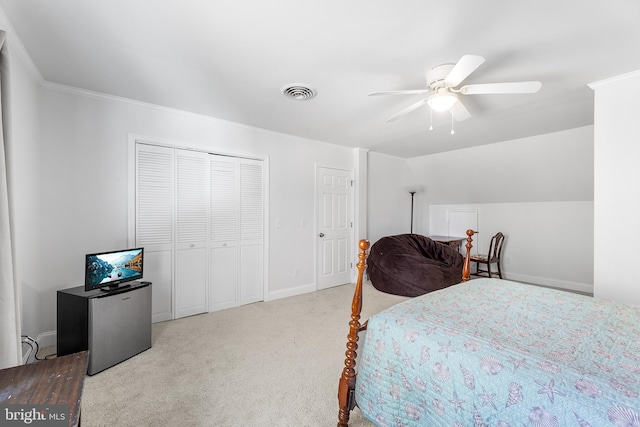 carpeted bedroom featuring ceiling fan and ornamental molding