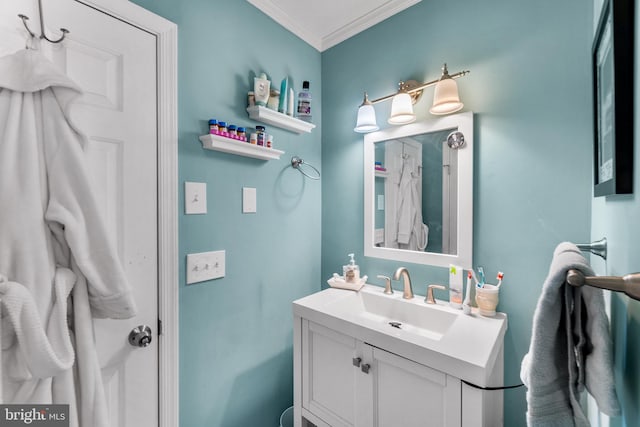 bathroom with vanity and ornamental molding