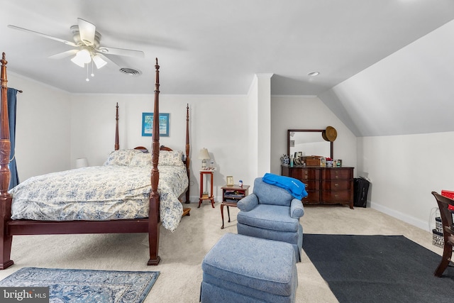 bedroom featuring ceiling fan, light colored carpet, and vaulted ceiling