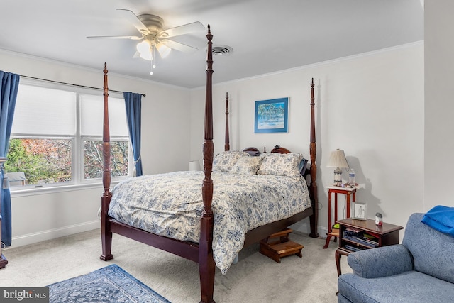 bedroom with ceiling fan, carpet floors, and crown molding