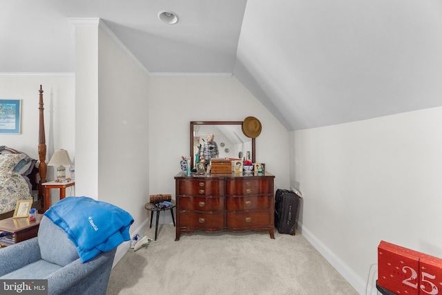 sitting room with light colored carpet, lofted ceiling, and ornamental molding