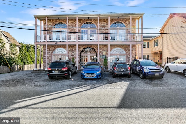 view of front of property with a balcony