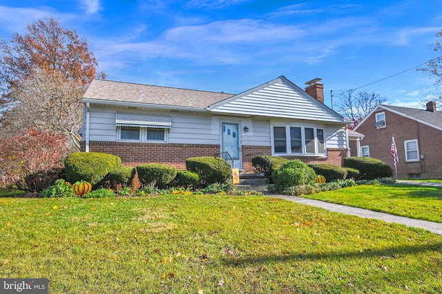 view of front of home with a front yard