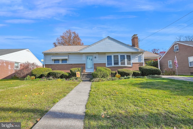 view of front of home with a front lawn