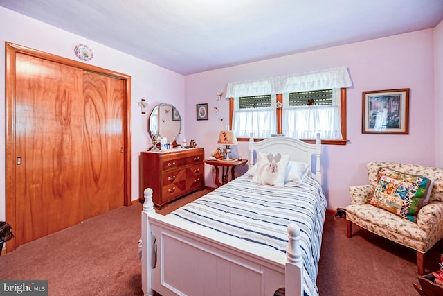 carpeted bedroom with a closet