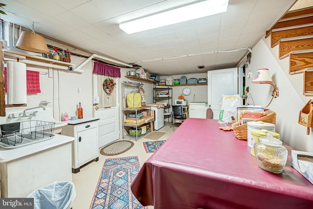 kitchen with white cabinetry and sink