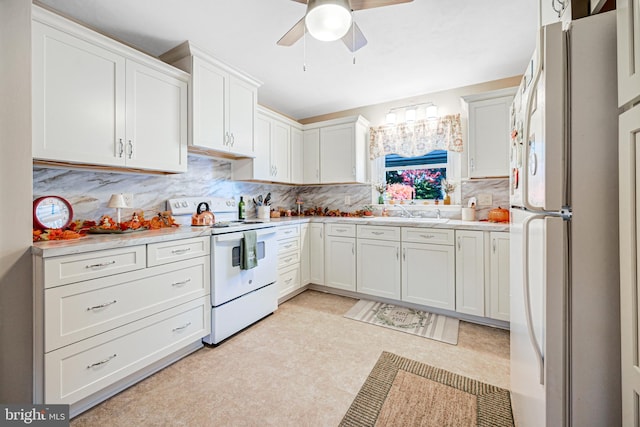 kitchen with backsplash, white cabinets, and white appliances