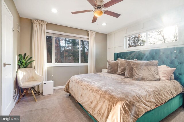 carpeted bedroom featuring ceiling fan