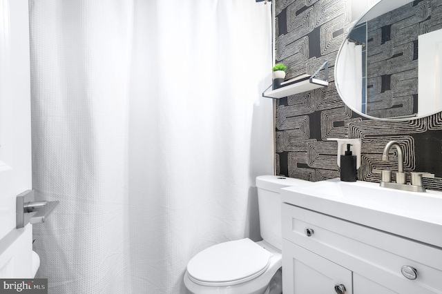 bathroom with vanity and toilet